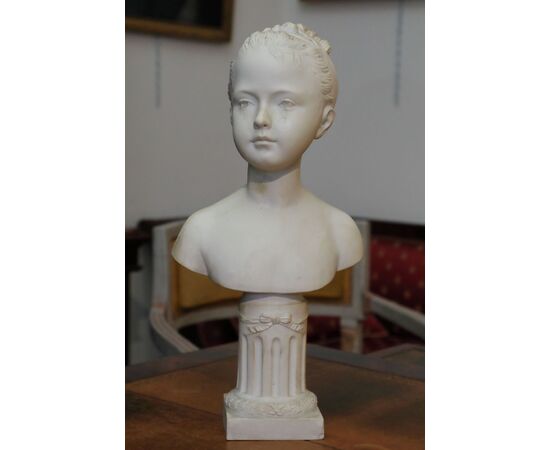 Small bust depicting a girl in bisque     