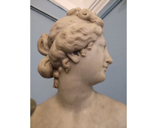 White marble statue with base, depicting Venus     