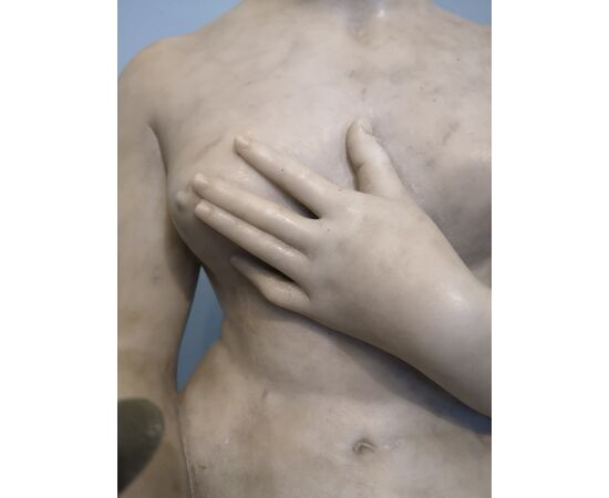 White marble statue with base, depicting Venus     