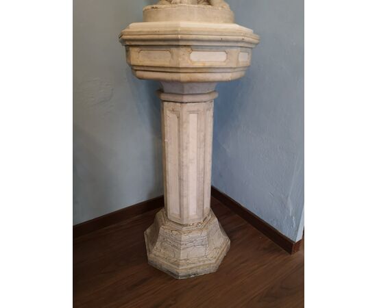 White marble statue with base, depicting Venus     