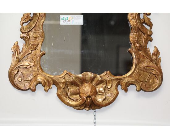 Shaped and carved gilded wooden mirror     