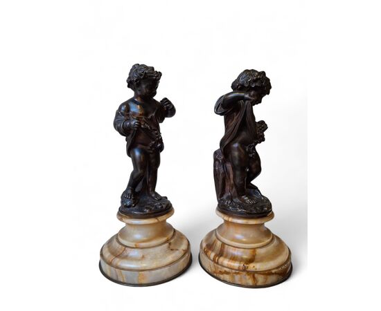 Coppia di putti in bronzo cesellato