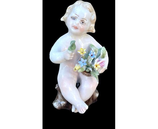 Coppia di putti in porcellana con cesto di fiori.Manifattura Ginori.