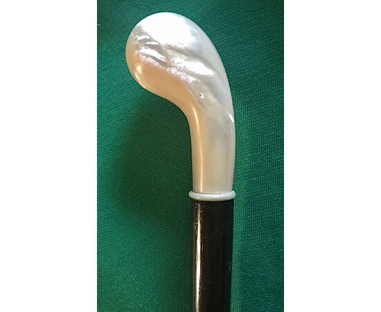 Walking stick with mother-of-pearl knob and rosewood barrel.     
