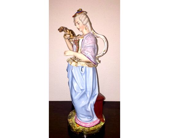 Veilleuse tisaniera figured in polychrome porcelain in the shape of a lady with a dog.Model Jacob Petit.France. 38 cm.     
