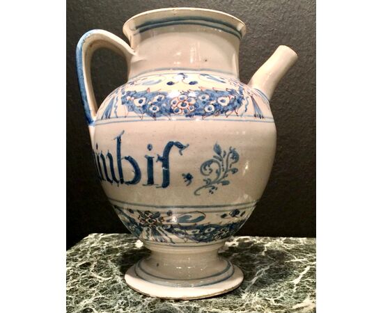 Majolica pourer decorated in blue monochrome with stylized festoons and plant motifs.Manardi Manufacture, Bassano.     