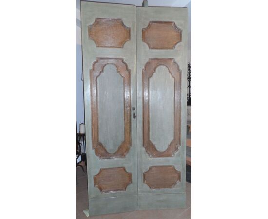 Baroque door with two doors painted in tempera.     