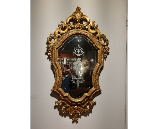 Carved and gilded Venetian mirror     