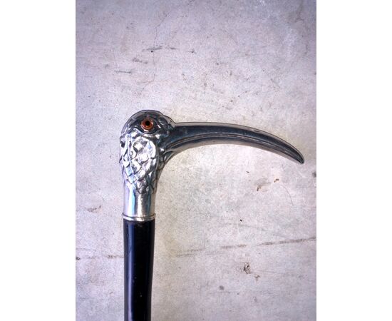 Stick with silver handle depicting an Ibis bird, ebony barrel.     