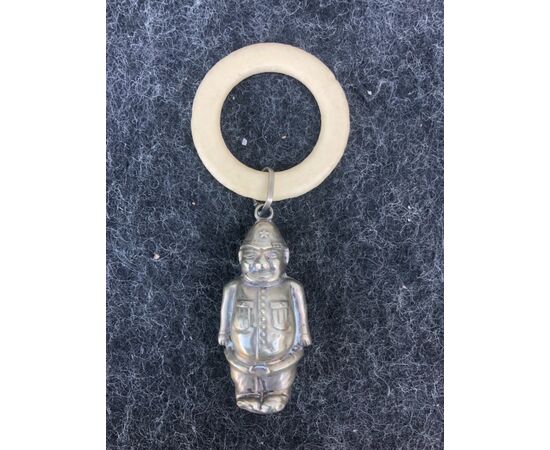Silver baby rattle depicting a soldier. Mother-of-pearl handle. Europe.     