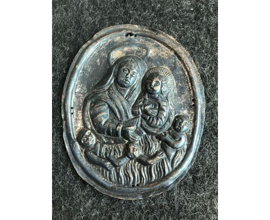 Silver tabard plaque depicting Madonna with Child and purgative souls. Brotherhood of souls. Genoa     