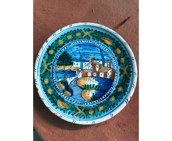 Raised majolica plate with landscape and architecture decoration, Urbania manufacture (Casteldurante),     