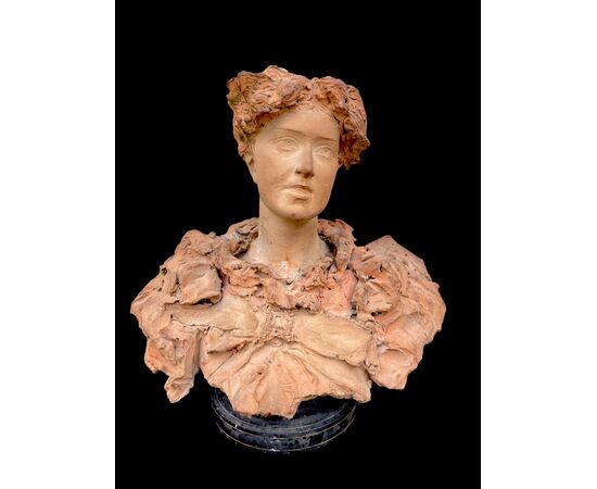 Scultura in terracotta raffigurante busto femminile.firma:Italo Campagnoli,data 1897. 