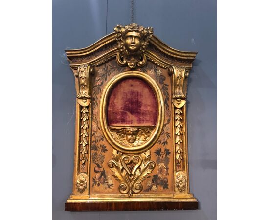 Wooden panel with central shelf for objects and side part painted with floral motifs. Italy.     