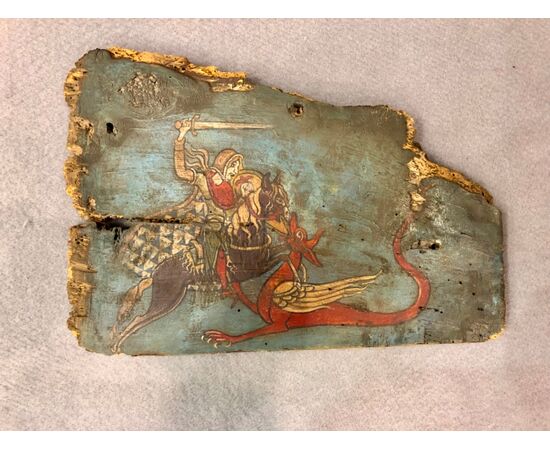 Panel in painted Sicilian cart wood with painted scene Saint George and the dragon.     