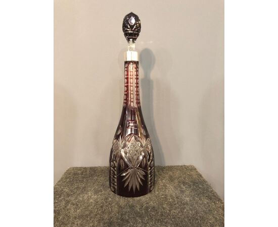 Bohemian engraved bottle with silver neck.     