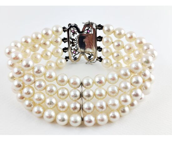 Bracciale oro bianco con rubini e 4 fili di perle