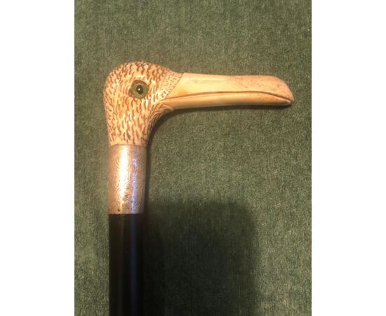 Stick with deer bone handle depicting a bird&#39;s head.     