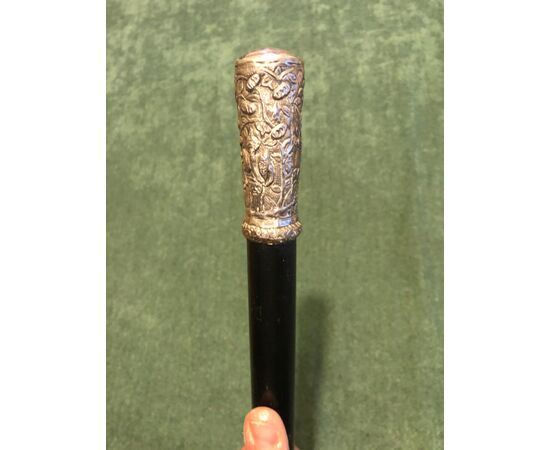Stick with silver knob engraved with characters and landscape. China.     