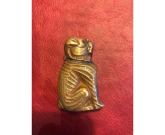 Brass matchbox in the shape of a seated dog.     