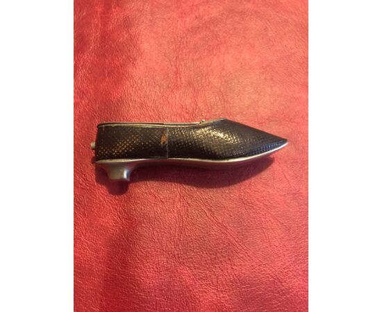 Metal and leather shoe-shaped matchbox.     