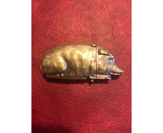 Silver-plated pig-shaped matchbox in bronze.     