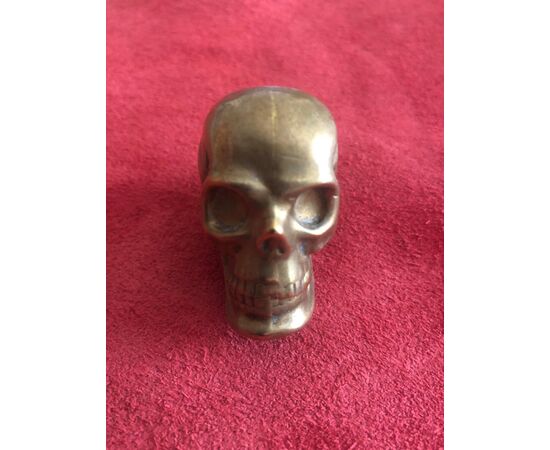 Brass matchbox in the shape of a skull.     