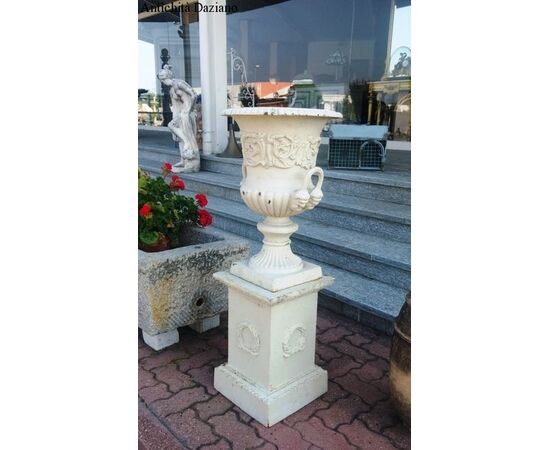 Pair of cast iron vases with pedestal     