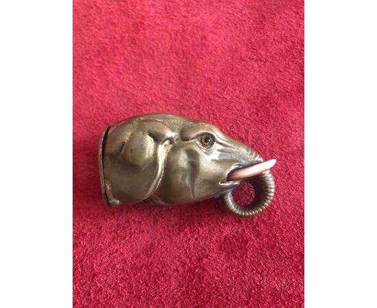 Brass matchbox depicting elephant head. Ivory tusks.     