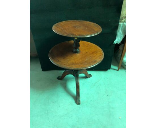 Gueridon walnut coffee table with two shelves and three feet.     