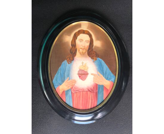 Oval oil painting on canvas depicting the figure of Christ.     