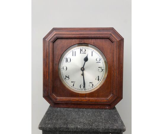 Wall clock in oak wood. Deco period.     