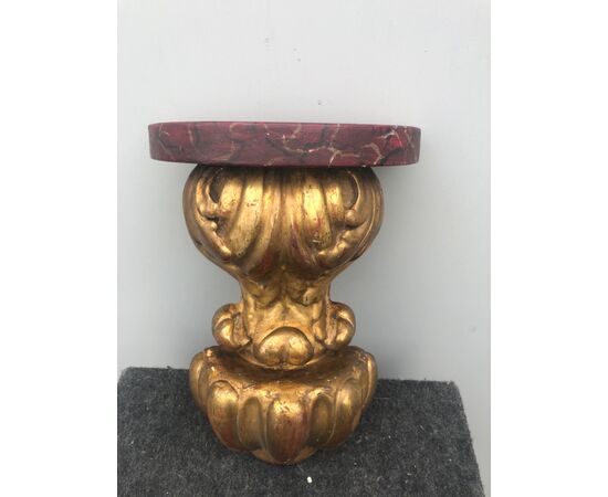 Gilded wooden shelf with plant and geometric motifs. Marbled top (added later).     