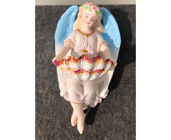 Holy water stoup in bisque porcelain with angel figure. France.     
