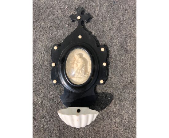 Holy water stoup in ebonized wood and porcelain bowl with sea foam oval with saint figure. France.     