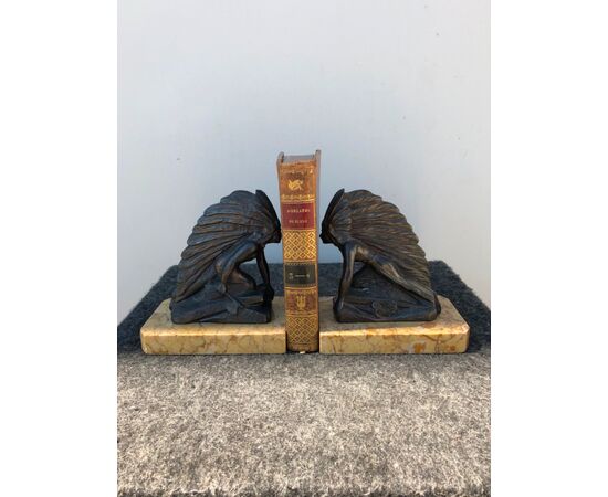 Pair of metal and marble bookends depicting two Red Indians.     
