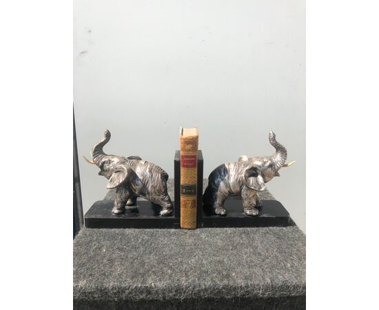Pair of silver and terracotta wooden bookends depicting elephants. Signed. Italy.     