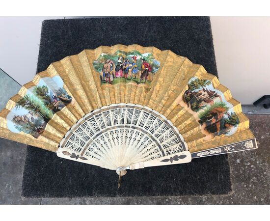 Openwork ivory fan with Pavese paper with watercolor prints with gallant and rustic scenes. France.     