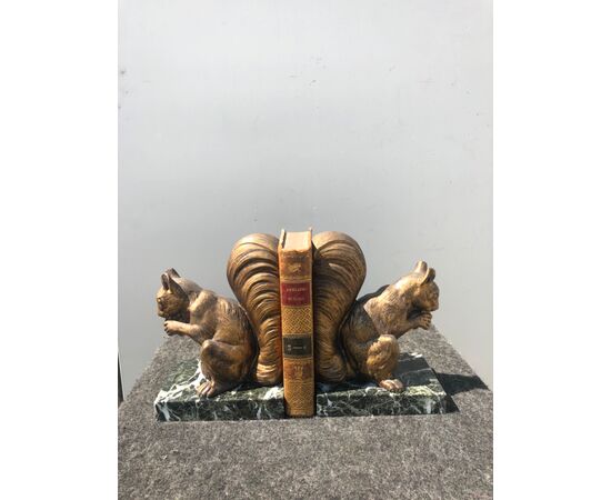 Pair of marble and golden antimony bookends depicting a pair of squirrels.     