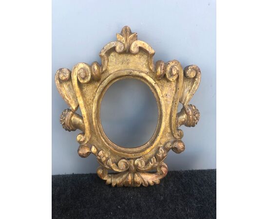 carved and gilded wooden frame with rocaille decoration. Directory period.     