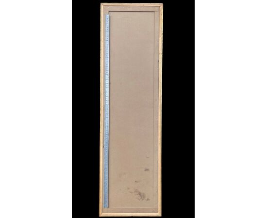 Grande specchiera in legno intagliato e dorato.