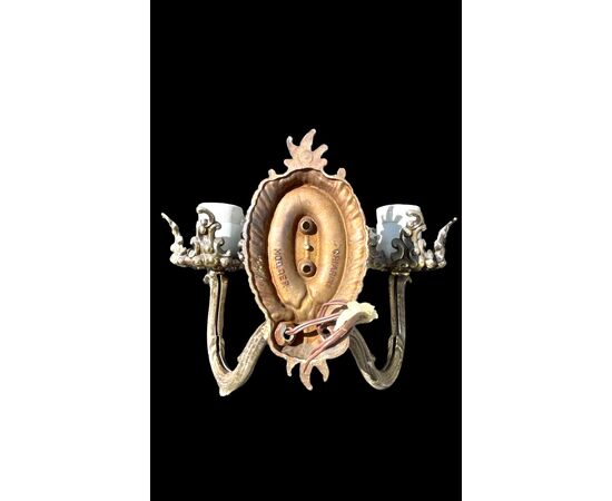 Coppia di lampade applique in bronzo a due fuochi.Marchio Chiarini.