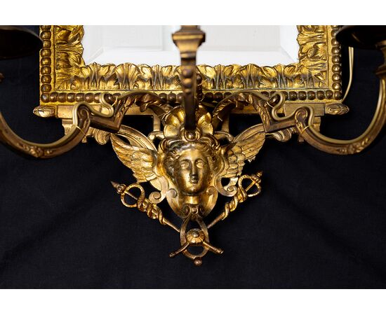 Pair of antique "Ventoline" mirrors, Napoleon III style, in gilded and chiseled bronze. France, 19th century.