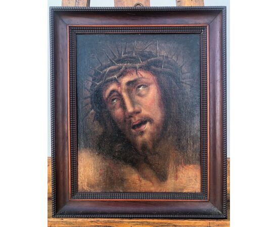 Oil painting on canvas depicting the face of Christ with crown of thorns.     