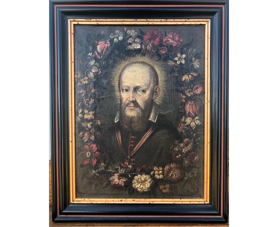 Dipinto olio su tela raffigurante San Francesco di Sales contornato da fiori.Autore Mario dei Fiori (Mario Nuzzi).Roma.