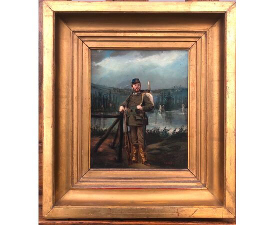 Oil painting on cardboard with the figure of a soldier on a rural background.Signed: Eraud     