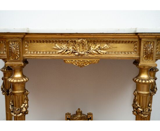 Antique Napoleon III console table in gilded and carved wood with a white marble top. France, 19th century.