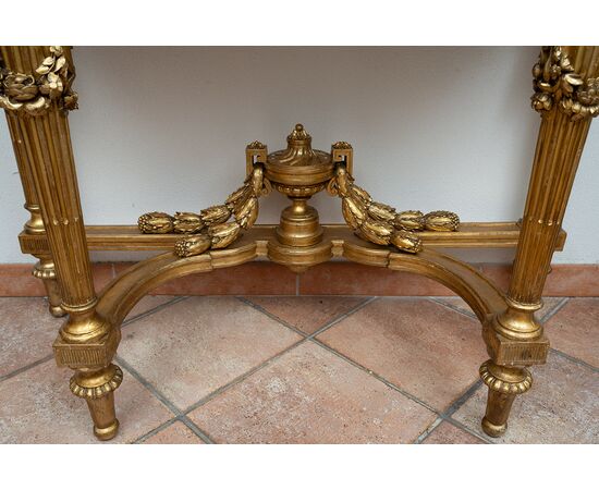 Antique Napoleon III console table in gilded and carved wood with a white marble top. France, 19th century.