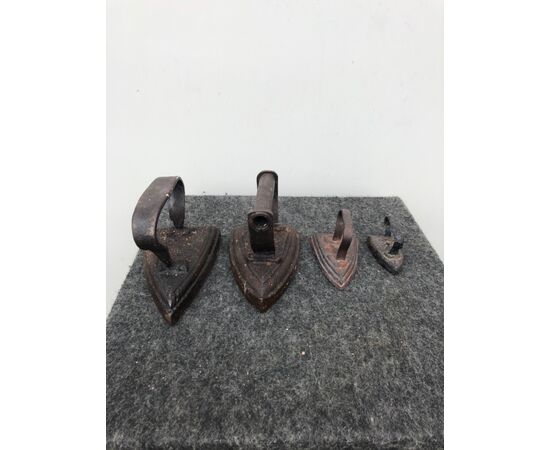 Four irons of different sizes in solid iron.     
