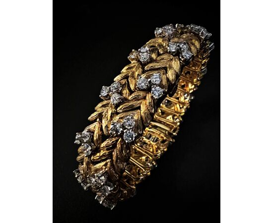 Bracciale  con  orologio  a scomparsa  firmato  " EBEL " 